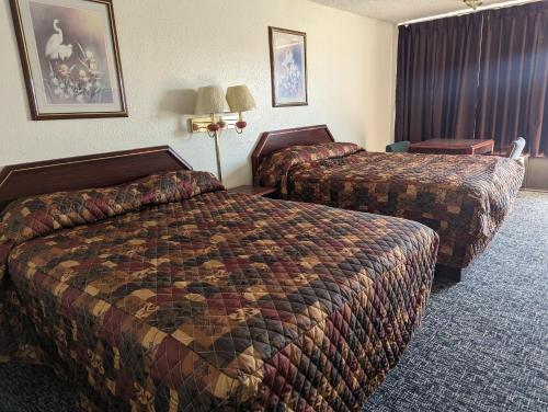 מיטה או מיטות בחדר ב-Luxury inn