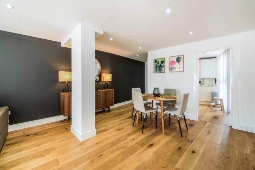 a dining room with a table and chairs at 7 Borough Apartments - Spacious 2-Bed, 2-Bath in Prime Location in London