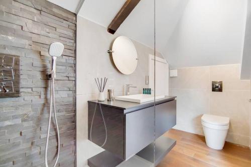 a bathroom with a sink and a mirror at Number 12 Borough Apartments 2 Bed 2 Bath in London