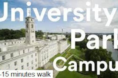 a sign that says university park campus with a building at Newly refurbished studio, great location 8 studios in Nottingham