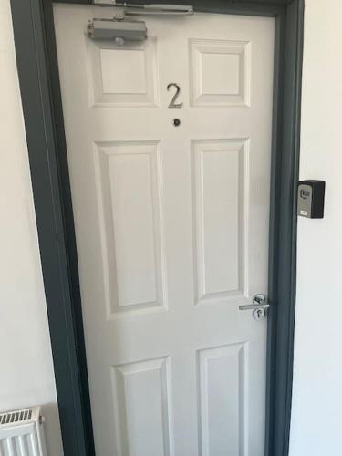 a white door with the number two on it at Newly refurbished studio, great location 8 studios in Nottingham