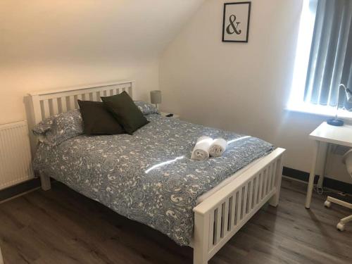 a bedroom with a bed with two towels on it at Newly refurbished studio, great location 8 studios in Nottingham