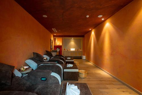 a large living room with couches and a wall at Sala Grand Tuy Hoa Hotel in Tuy Hoa