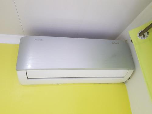 a white router sitting on top of a ceiling at Jazmin's Apartment in Oranjestad