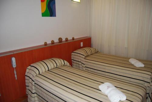 Postel nebo postele na pokoji v ubytování Hotel Necof