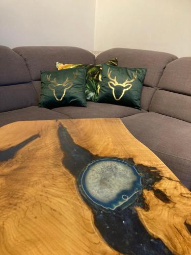 a bed with a painting of a animal on it at Apartament Deluxe in Jelenia Góra