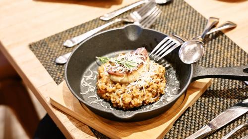 a pan filled with food on top of a table at ANA Holiday Inn Sendai by IHG in Sendai