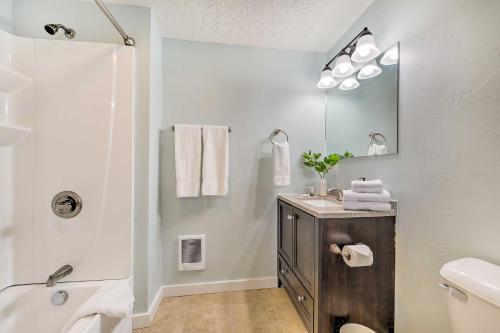 a white bathroom with a sink and a shower at Centrally Located Pinedale Vacation Rental! in Pinedale