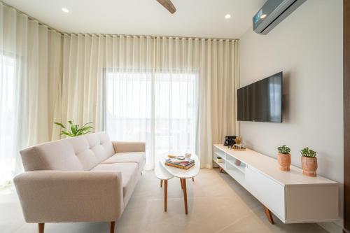 TV a/nebo společenská místnost v ubytování Kippal - Modern Oasis - ApartHotel