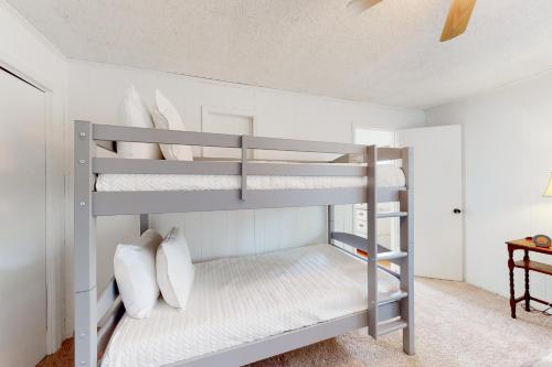 a bedroom with two bunk beds in a room at Our Happy Place in Newland in Newland