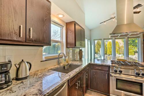 a kitchen with a sink and a stove at Bellingham Vacation Rental with Private Deck in Bellingham