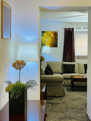 a living room with a couch and a table at Hotel Marcincak*** in Mikulov