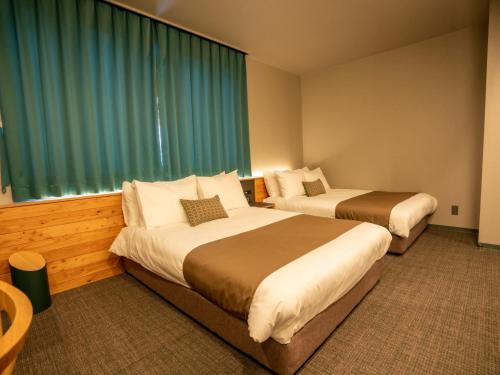 Una cama o camas en una habitación de UUHOME
