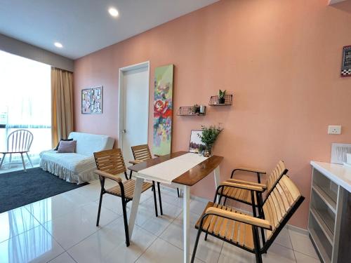 a living room with a dining room table and chairs at The Robertson 2B at Bukit Bintang with Netflix,trx,klcc,pavilion,lalaport in Kuala Lumpur