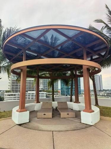 a gazebo with benches on top of a building at Almas Suites Muji 100mbps Netflix By STAY in Nusajaya