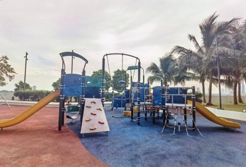a playground with a slide and a slidesktop at Almas Suites Muji 100mbps Netflix By STAY in Nusajaya