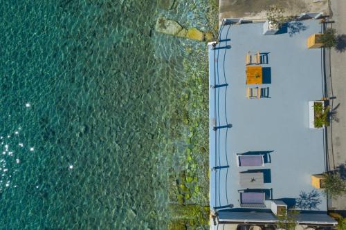 an aerial view of the ocean with houses on the shore at Seafront Karma Luxury - An Escape From Reality in Kato Gatzea