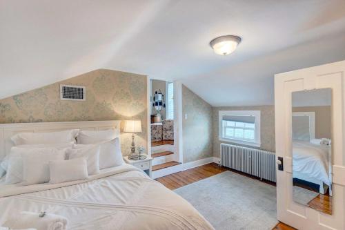 a bedroom with a large white bed in a room at Classic Brookfield Home about 14 Mi to Milwaukee! in Brookfield