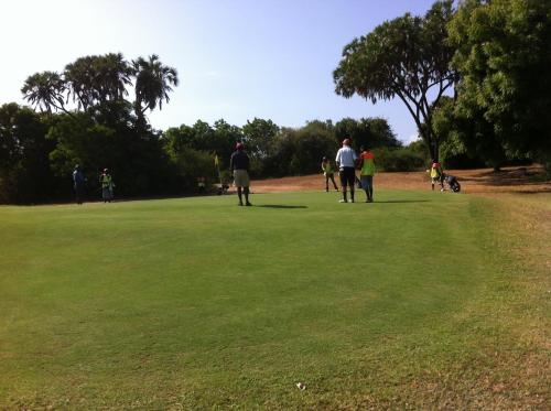 a group of people walking on a field of grass at Lions' Luxury Eco Resort & Spa in Malindi