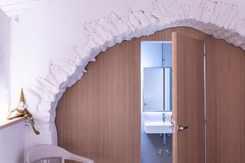 a bathroom with a sink and a mirror at Hotel Monells Summum in Monells