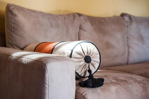 a person laying on a couch with a fan at Fattoria San Lorenzo in Grosseto