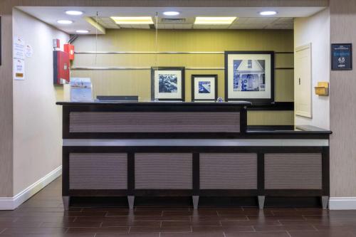 a large piano in a hallway of a hospital at Baymont by Wyndham Saraland in Saraland