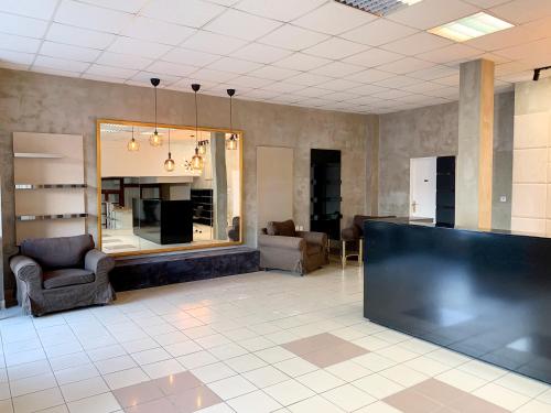 a lobby with a waiting room with chairs and a mirror at Holiday home Prague in Prague
