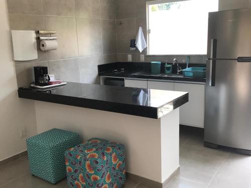Η κουζίνα ή μικρή κουζίνα στο Conforto e Aconchego em Imbassaí/BA