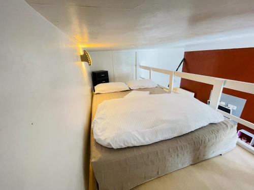 Кровать или кровати в номере Le Carré D'or 2 Pers Centrale