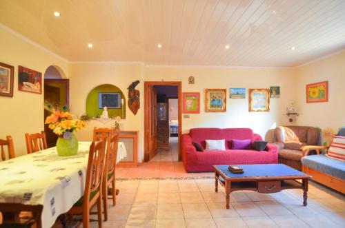 a living room with a couch and a table at Club Villamar - Apartment Amity in Maçanet de la Selva