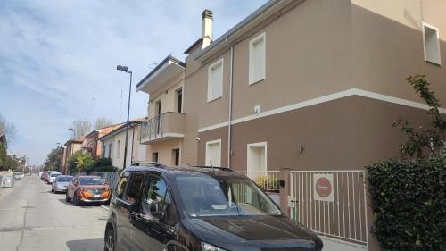 a car parked on a street next to a building at Darsena b&b tra arte e mare in Ravenna