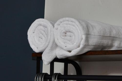 a pile of towels sitting on top of a table at Stunning House wParking Sleeps7 in Darlington