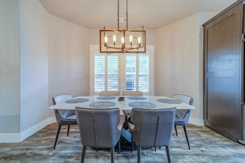 a dining room with a white table and chairs at Mojo's Dojo in McKinleyville