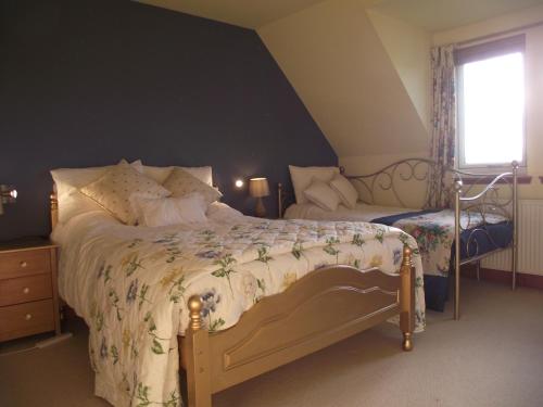 A bed or beds in a room at RetreatOnThe500 B&B