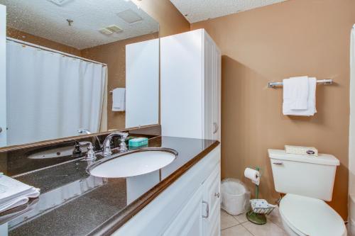 a bathroom with a sink and a toilet at Pirates Bay A307 in Fort Walton Beach