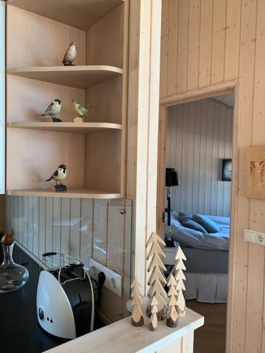 a room with a desk and a bedroom with a bed at Paradise near Reykjavik w. Sauna - Northern Lights in Mosfellsbær