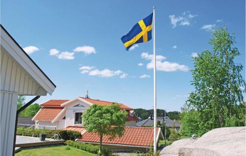 a british flag flying in front of a house at Amazing Home In Västra Frölunda in Västra Frölunda