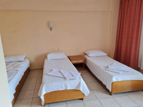 Katil atau katil-katil dalam bilik di Caner Mountain Hotel