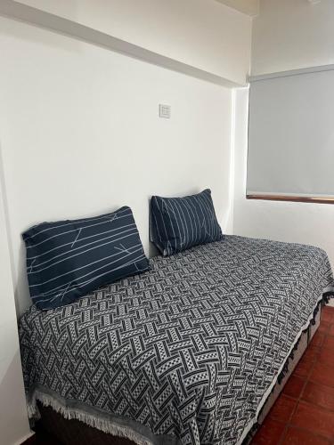 מיטה או מיטות בחדר ב-TRES CERRITOS SALTA