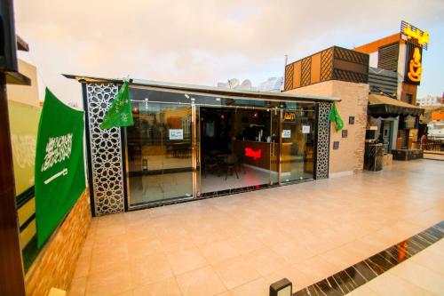 a store front with glass doors in a shopping mall at شقق المصيف للشقق المخدومة in Abha