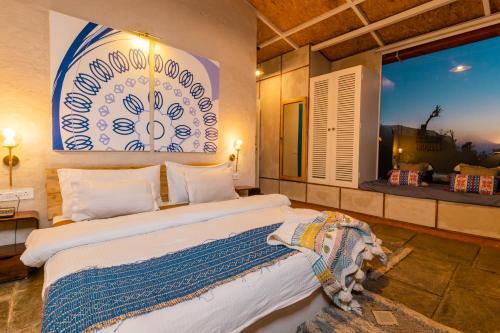 a bedroom with a large bed and a window at SHIVAYA since 1953 in Mukteswar