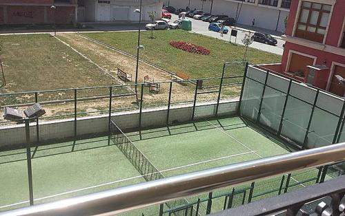 a tennis court on top of a building at FOZ II PLAYAS in Foz