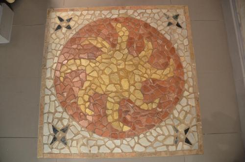 a mosaic tile on the floor of a bathroom at Portman cosy in Toulon