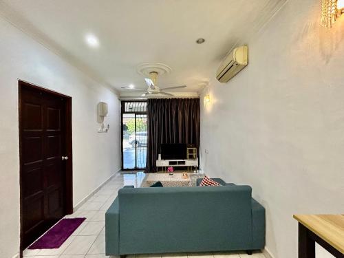 a living room with a couch and a ceiling fan at Home14#2pax#Wifi&Netflix#NearAeonAlma&Lotus in Bukit Mertajam