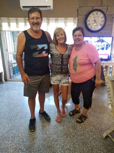a group of three people posing for a picture at Mi Lugar en el Mundo in Buenos Aires