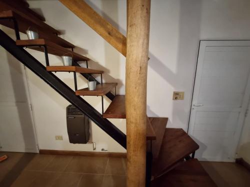 a spiral staircase in a room with a door at Pindó I in Concordia