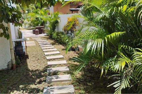 a pathway with stepping stones in a yard at Casa LeoMa in Cavite
