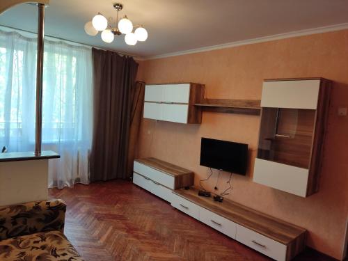 a living room with a television on a wall at Комфортная квартира!!! in Tiraspol
