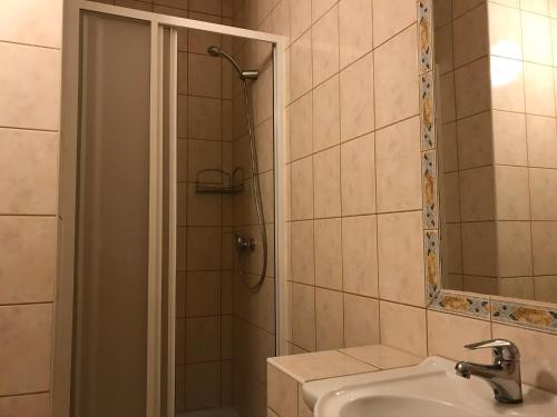 a bathroom with a shower and a sink at Garni pension U svatého Urbana in Mikulov