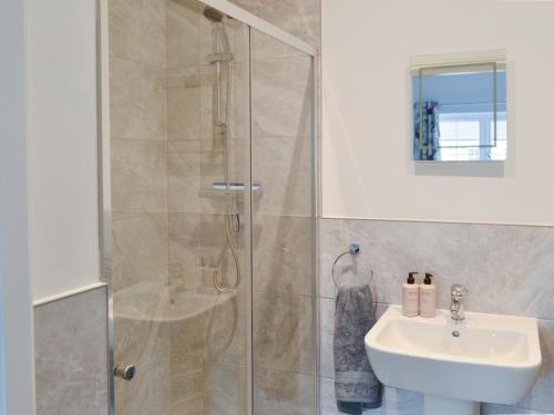 a bathroom with a shower and a sink at Ad Gefrin in Acklington